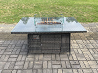 Dark grey wicker rattan garden set with gas fire pit table, 3-seater sofa, and reclining chairs.