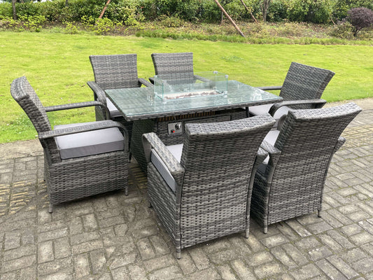 Cozy outdoor ambiance with dark grey rattan dining set and gas fire pit table.